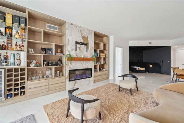 17111 Biscayne Blvd Unit 304, North Miami Beach, FL 33160 - living room featuring a fireplace, tile patterned floors, and beverage cooler