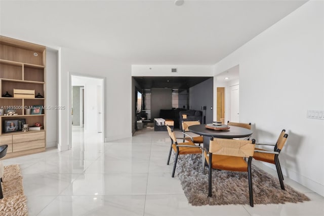 17111 Biscayne Blvd Unit 304, North Miami Beach, FL 33160 - dining area featuring baseboards