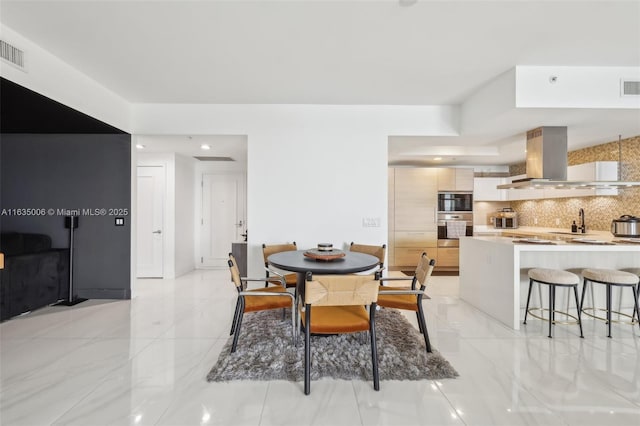 dining room featuring sink