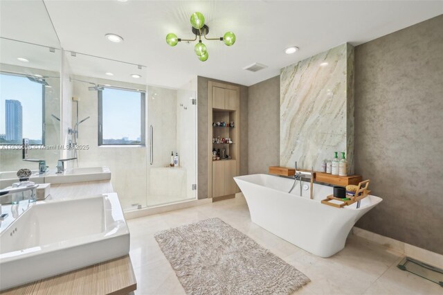 17111 Biscayne Blvd Unit 304, North Miami Beach, FL 33160 - bathroom with a stall shower, double vanity, a freestanding tub, and recessed lighting
