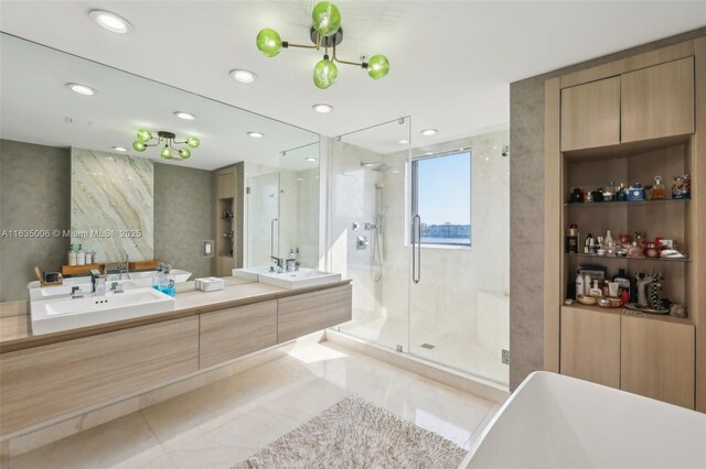 17111 Biscayne Blvd Unit 304, North Miami Beach, FL 33160 - full bath with a stall shower, double vanity, tile patterned flooring, a freestanding bath, and recessed lighting
