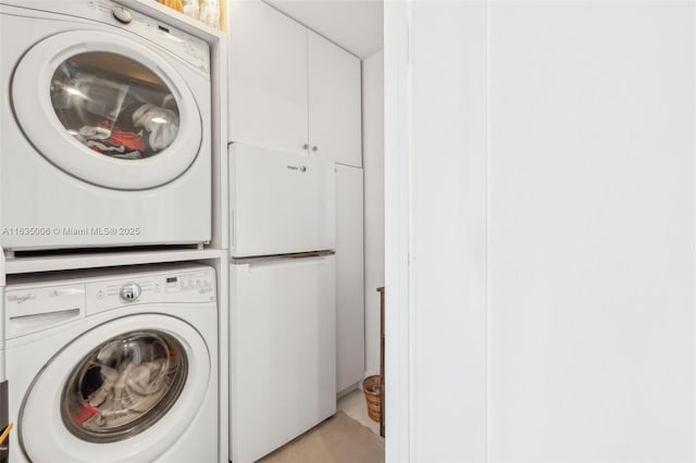 laundry room featuring stacked washer and clothes dryer