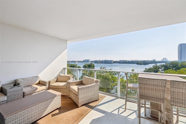 balcony featuring a water view