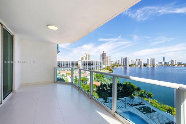 balcony featuring a water view and a view of city