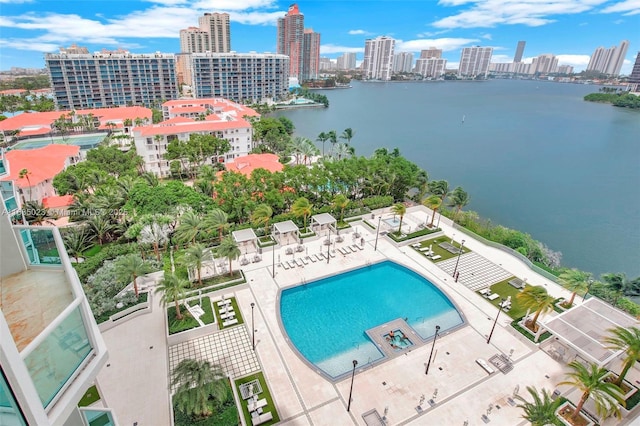 birds eye view of property with a water view