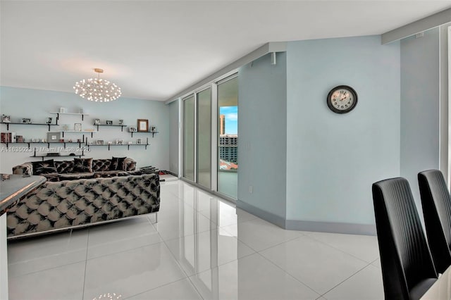 living area with baseboards, expansive windows, an inviting chandelier, and light tile patterned floors