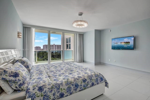 bedroom featuring baseboards, access to exterior, an inviting chandelier, and tile patterned floors