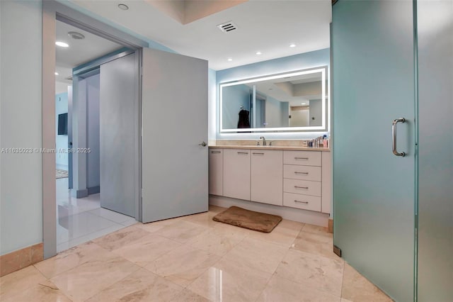 full bath with visible vents, recessed lighting, and vanity