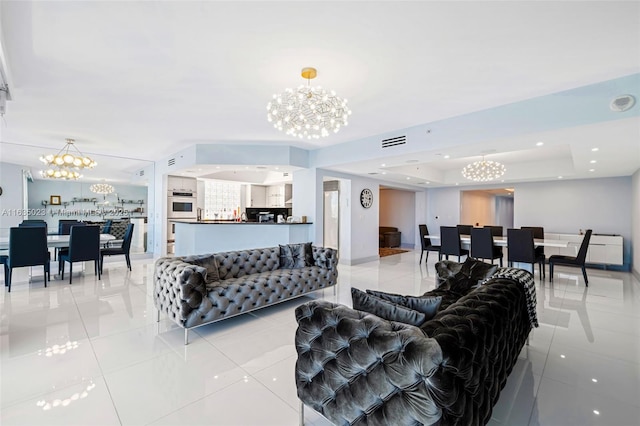 tiled living room with an inviting chandelier and a raised ceiling