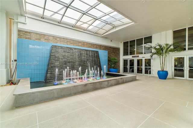 view of swimming pool featuring french doors