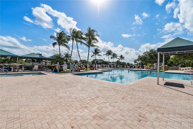 view of swimming pool featuring a patio area and a gazebo