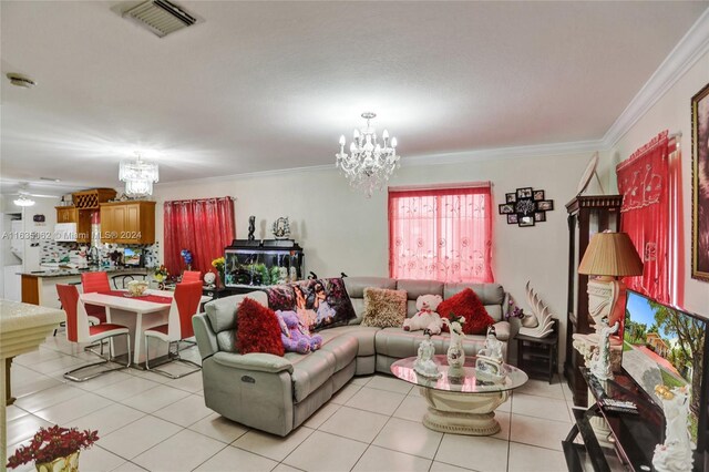 living room featuring ornamental molding, light tile patterned floors, and an inviting chandelier