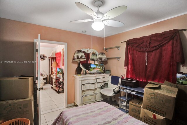 tiled bedroom featuring ceiling fan and ornamental molding