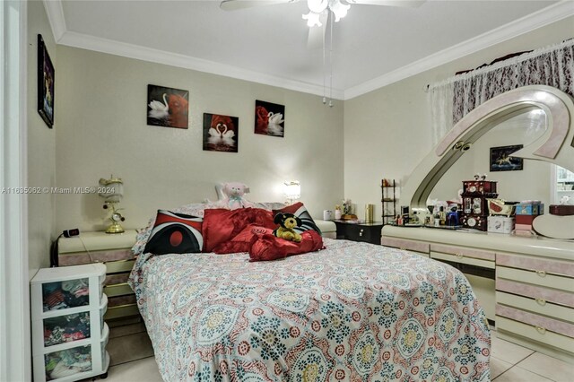 tiled bedroom featuring ceiling fan and ornamental molding