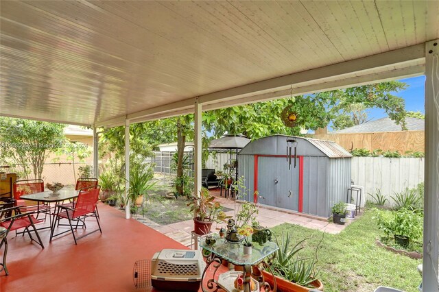 view of patio with a storage shed