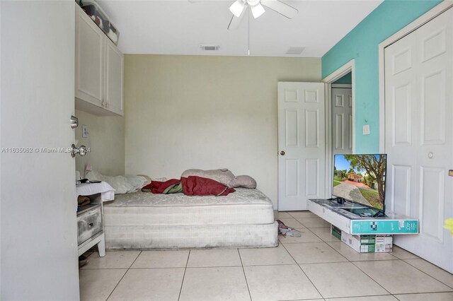 bedroom featuring ceiling fan and light tile patterned flooring