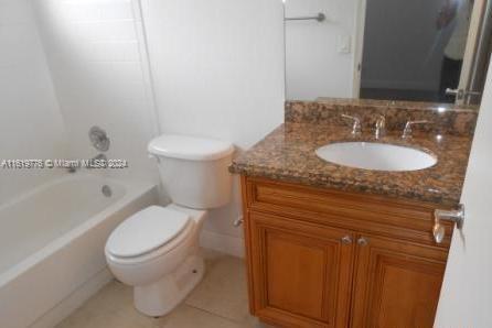 full bathroom featuring vanity, tile patterned flooring, shower / tub combination, and toilet