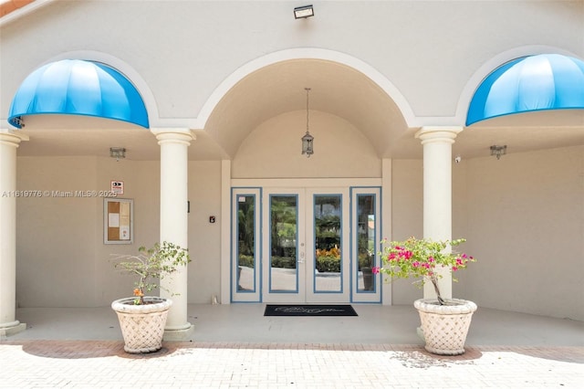 1482 Lake Crystal Dr Unit H, West Palm Beach, FL 33411 - entrance to property with stucco siding and french doors