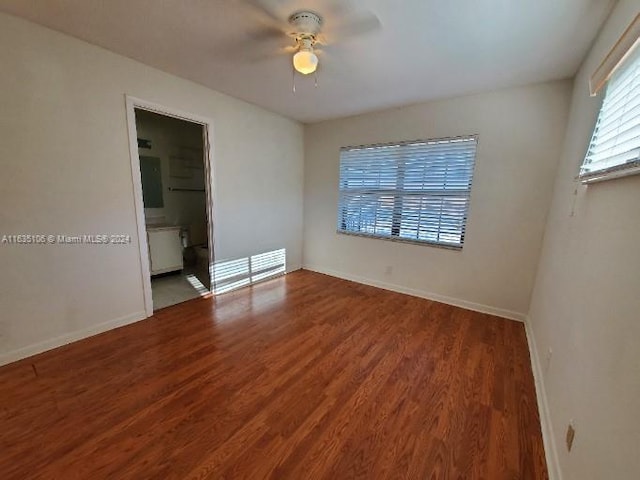 empty room featuring hardwood / wood-style flooring and ceiling fan