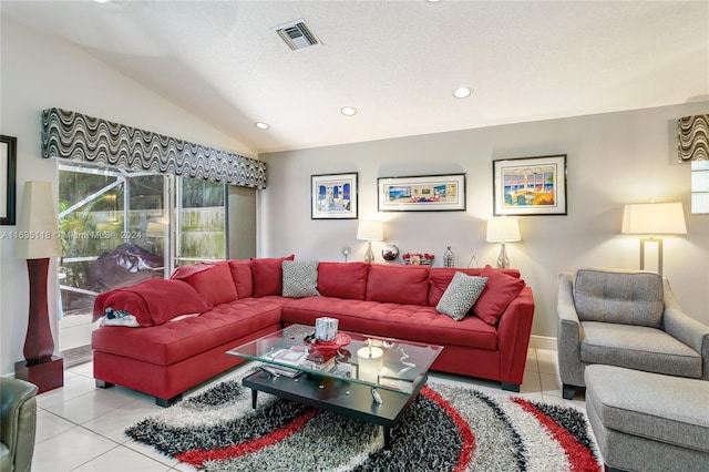 living area featuring lofted ceiling, light tile patterned flooring, visible vents, and recessed lighting