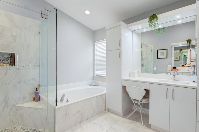 full bath featuring marble finish floor, a garden tub, vanity, and a marble finish shower