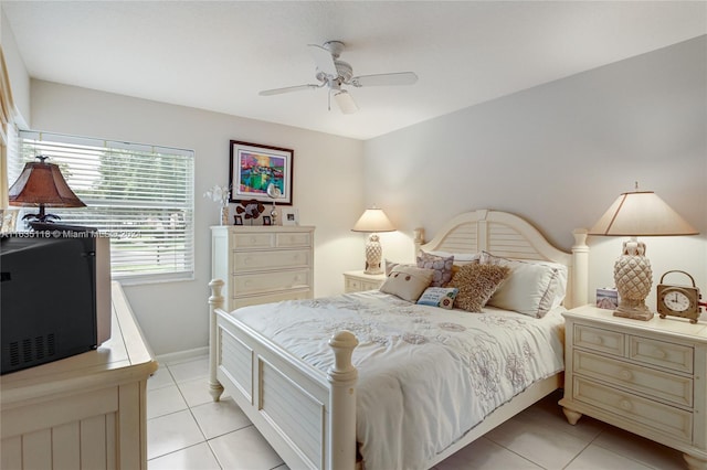 tiled bedroom with ceiling fan