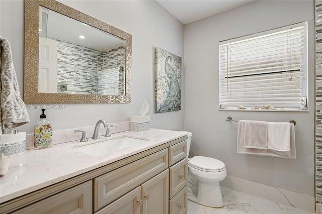 bathroom featuring toilet, tile patterned floors, and vanity