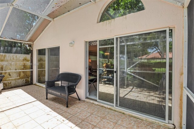 sunroom / solarium with lofted ceiling