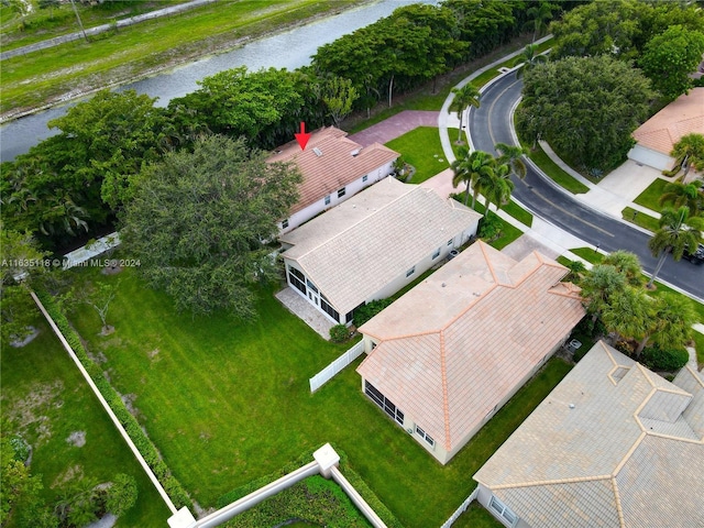 birds eye view of property featuring a water view