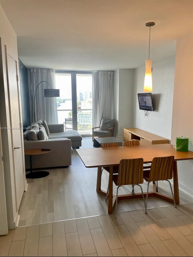 dining space featuring light hardwood / wood-style flooring