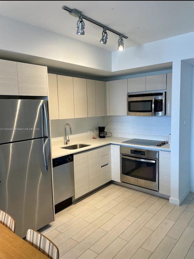 kitchen with appliances with stainless steel finishes and sink