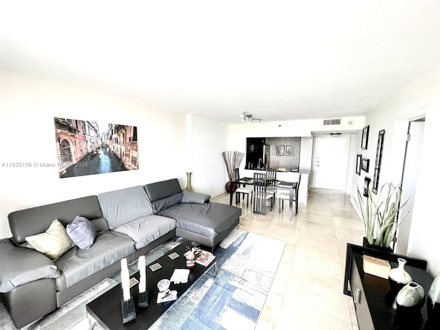 living room with light tile patterned flooring