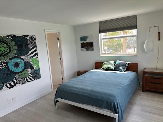 bedroom with light hardwood / wood-style floors