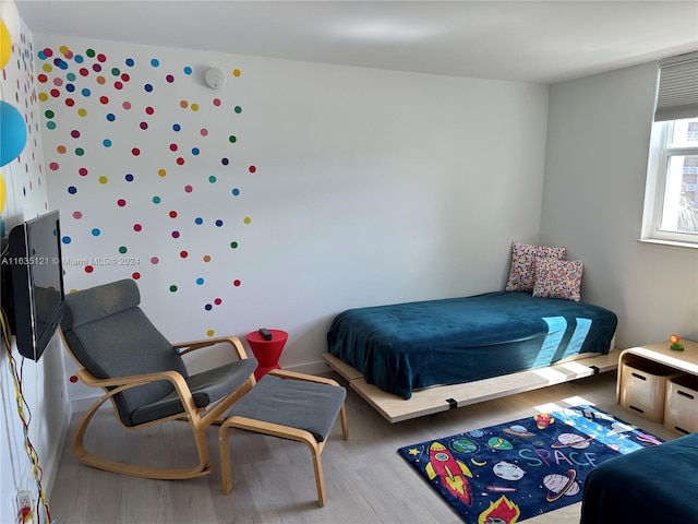 bedroom featuring hardwood / wood-style floors