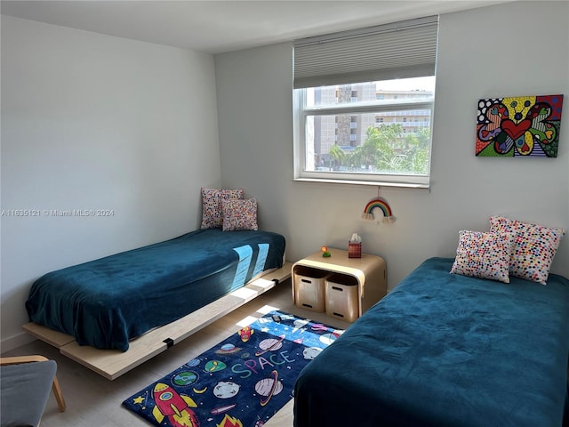 bedroom with wood-type flooring