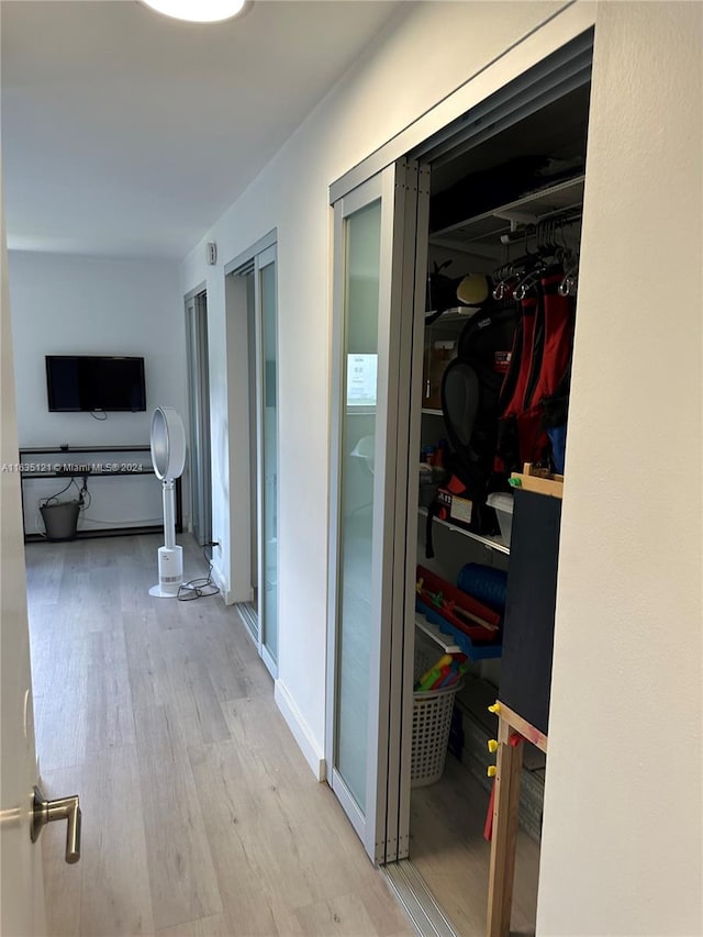 hallway featuring light hardwood / wood-style flooring