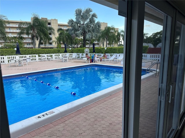 view of swimming pool featuring a patio