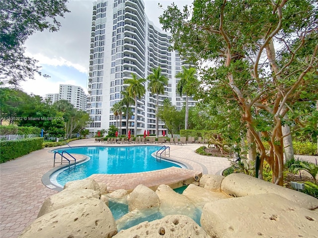 community pool with a patio area