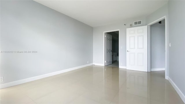 unfurnished bedroom featuring tile patterned flooring