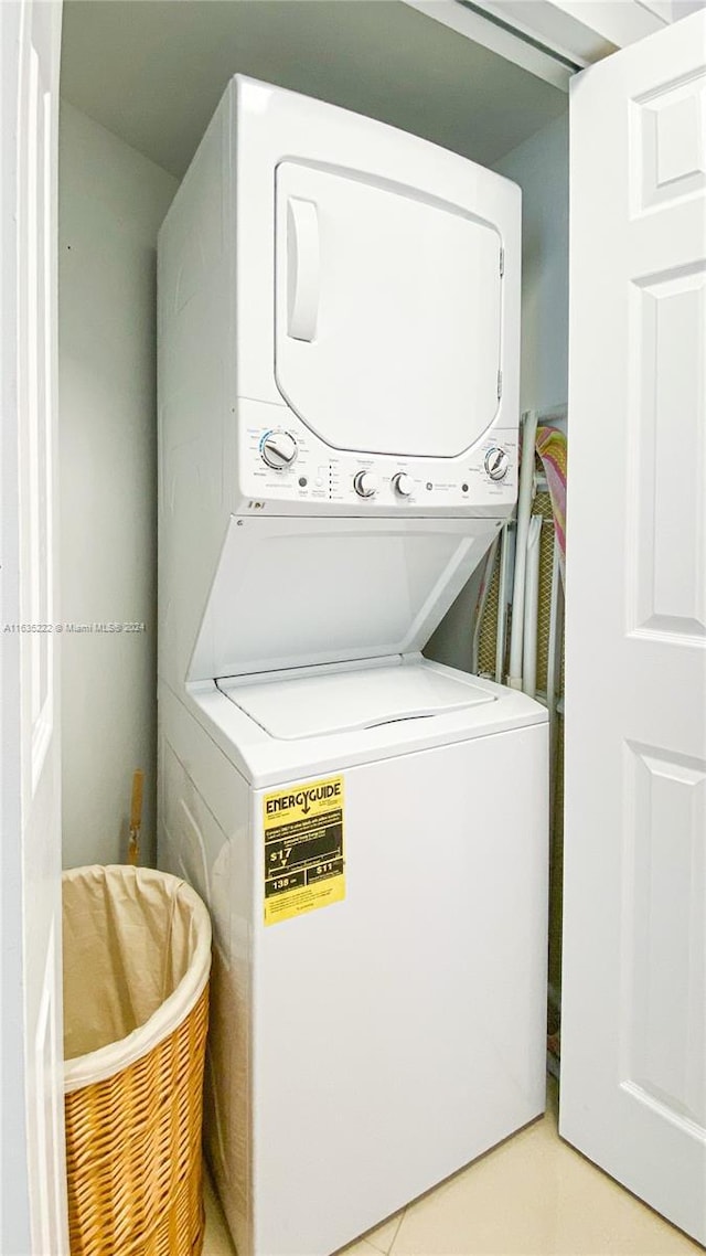 washroom with laundry area and stacked washer / drying machine