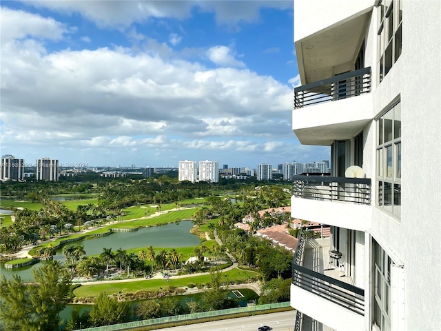 exterior space with a city view and a water view