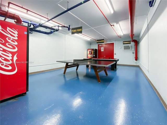 playroom with finished concrete floors and baseboards