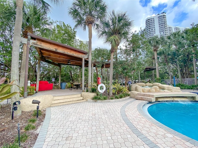view of pool featuring a patio, a fenced in pool, and fence