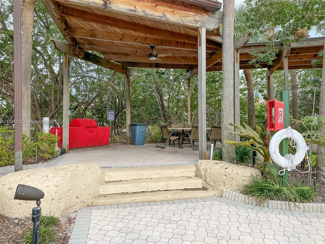 view of patio / terrace featuring outdoor dining space and a ceiling fan