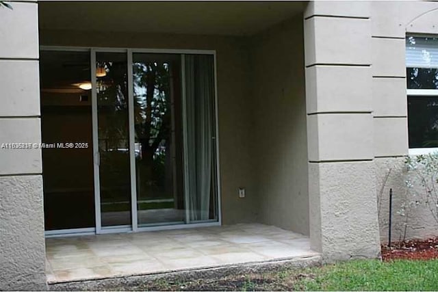 doorway to property featuring a patio area