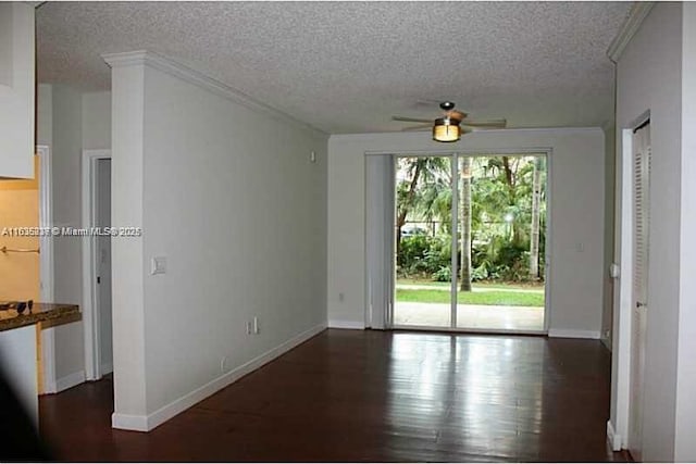 unfurnished room with ceiling fan, a textured ceiling, and ornamental molding