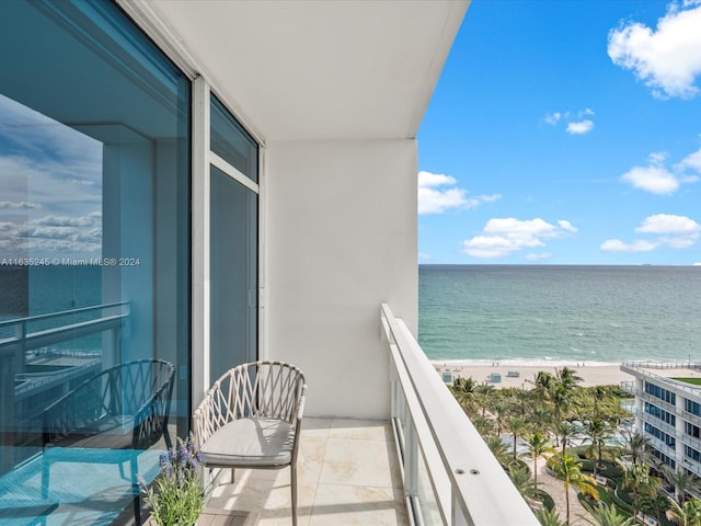 balcony with a view of the beach and a water view