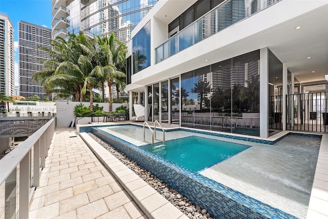 view of swimming pool featuring a patio area