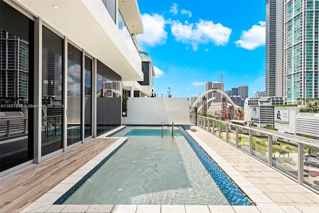 view of pool featuring central AC