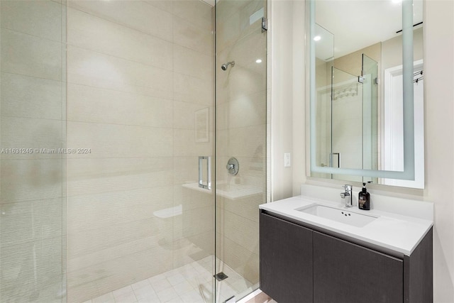 bathroom with an enclosed shower and vanity